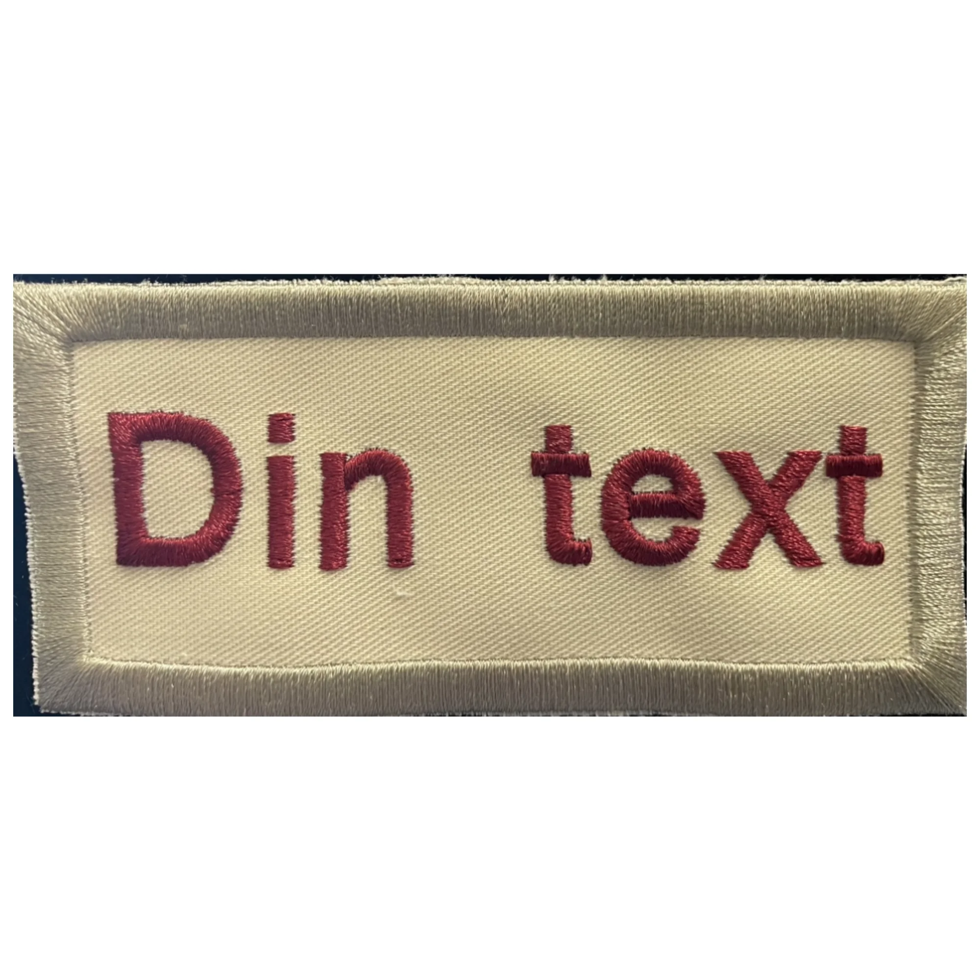 Broderat 10st tygmärke egen text